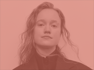 Liv Hewson Headshot: a non-binary person with loose, straggly hair.